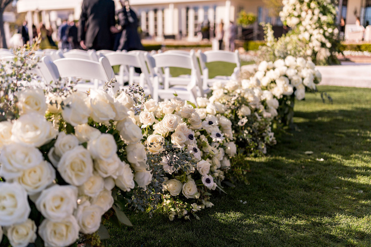 Rosewood Miramar Hotel wedding ceremony florals aisle