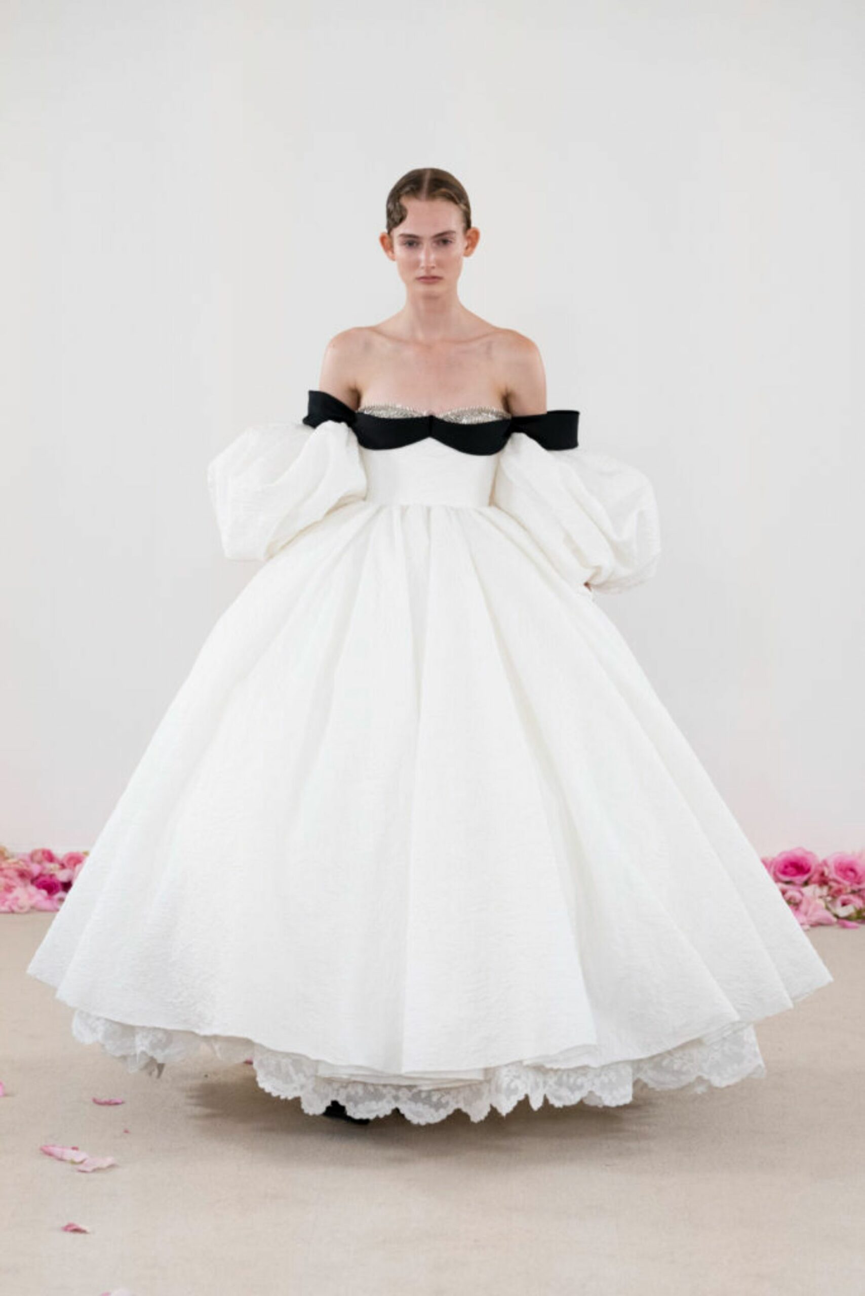 An all-white gown with black and bedazzled accents from the new Giambattista Valli Haute Couture 25 collection.